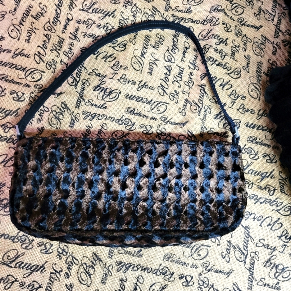 Gently used lancome faux fur small makeup bag with handle like new